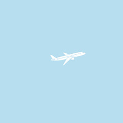 White Airplane in Light Blue Sky