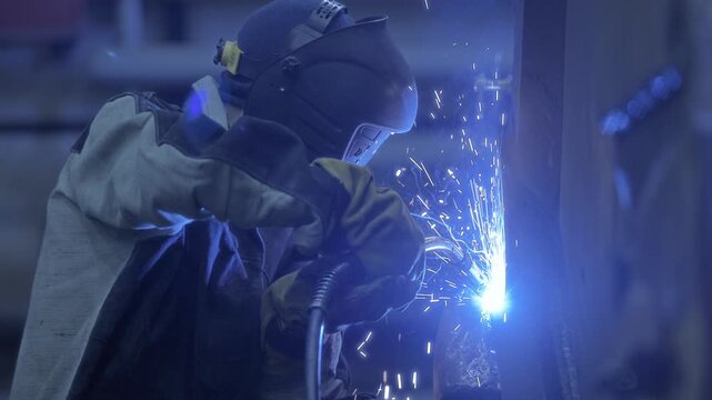 Professional welder fix industry truck in ore gold mining factory, technical service.