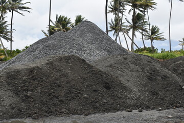 Piles of aggregates including gravel, stones and other materials from a quarry in Trinidad and...