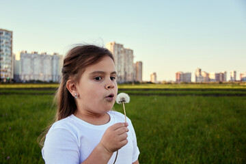 Fototapeta premium Kids playing and reading in the field