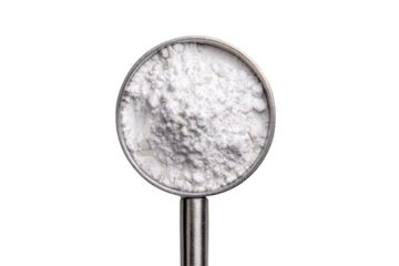 White powder in metal measuring cup.  Top view