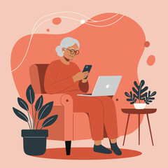 Smiling senior woman in earbuds uses her smartphone and laptop from a comfy armchair at home. Represents modern aging, digital connection, and cozy lifestyle.