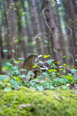 Crying angel in the undergrowth
