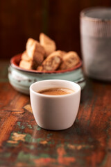 Cup of coffee on rustic wooden background. Soft focus. Copy space	