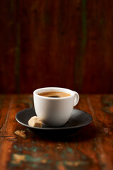 Cup of coffee on rustic wooden background. Soft focus. Copy space	