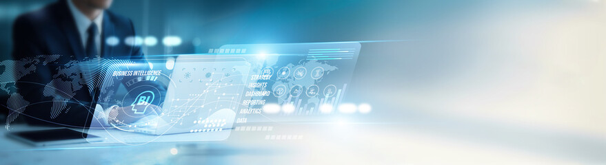 Manager using laptop analyzing business intelligence dashboards, performance metrics, data...