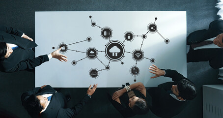 Collaborative Business Meeting with Digital Interface Overhead View Showcasing Technology and Data Connections for Strategic Computing Discussions. Amity