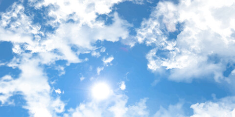 Obraz premium Fluffy white clouds drift across a beautiful blue sky on a bright summer day.