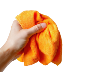 Hand holding a bright orange cleaning cloth against a black background