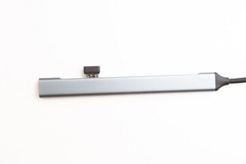 A modern compact USB hub displayed on a clean white background, perfect for showcasing connectivity...