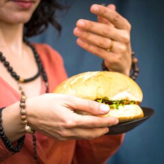 Woman holding a sandwich