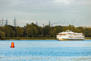  a white ship sails along the river. boat trip on the river. tourist river boat © Oleg Opryshko