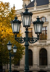 Vintage Street Lamps Illuminate Autumn Scenery in Front of Historic Building.