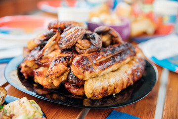 Assorted meat kebabs and mushrooms served on a plate are ideal for a diet.