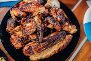 Assorted meat kebabs and mushrooms served on a plate are ideal for a diet.