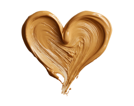A heart-shaped, light brown, creamy substance.  Viscous texture, smooth swirls, and flowing lines create the heart form