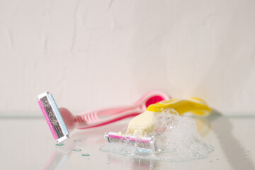 Razor blades in bathroom glass shelf