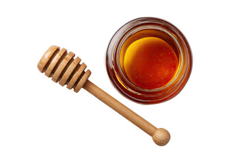 Honey in glass jar with wooden dipper