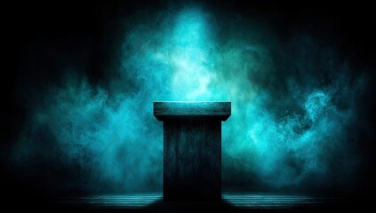 A dark, moody stage setting, illuminated by a turquoise spotlight, highlights a simple wooden pedestal, creating an atmospheric presentation space.