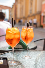 two alcoholic drinks cocktail aperol spritzer on the summer terrace in the restaurant