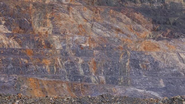 Industry landscape of Open pit mine with geological structure of quarry with iron vein and copper, gold and ore.