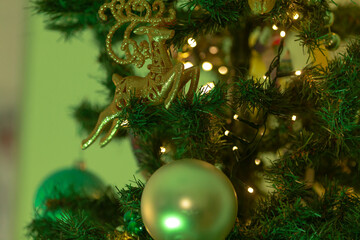 Close-up of a beautifully decorated Christmas tree featuring elegant ornaments and twinkling fairy lights, creating a festive holiday atmosphere.
