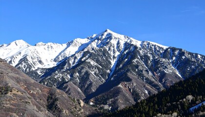 Snowy mountain range under a clear sky