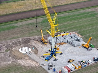 Large crane on the construction site of a wind turbine, aerial view, wind turbine, tower construction, renewable energies, energy transition, tower, prefabricated parts, hybrid tower, concrete parts