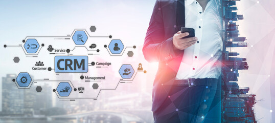 A businessman is using a smartphone in a modern city setting, surrounded by a visually striking CRM...