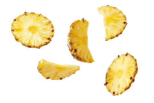 Pineapple slices scattered on a black background.  Golden yellow, slightly translucent slices, showing the fruit's interior.  Sharp edges and defined texture