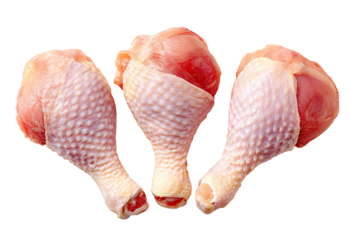 Raw chicken drumsticks arranged in a close-up, three-piece cluster, against a black background. The drumsticks are whole, uncooked, and display a pale pink-white flesh tone with visible skin texture