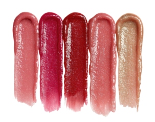 Four swatches of lip gloss in varying shades of pink and red