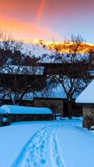 Snowy mountain village at dawn