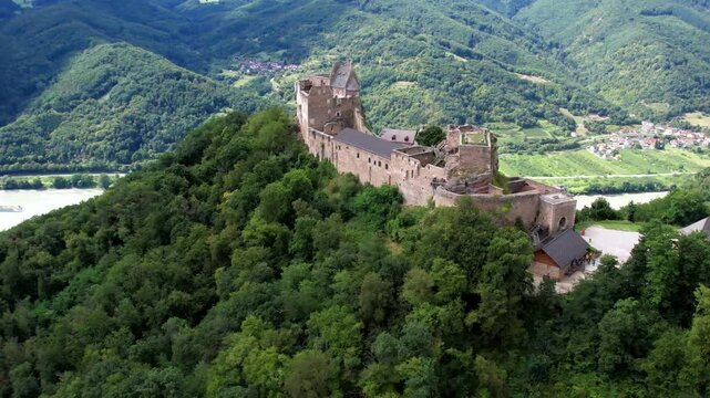 Austria tourism. Aggstein Castle, scenic Wachau valley with stunning view of Danube river. aerial drone footage.
Fortress one of the most famous castle ruins in Austria. 