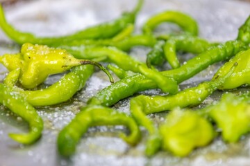 Mix of green peppers Shishito pepper Capsicum Annuum japonsea, or Japanese sweet pepper, not spicy and very tasty and Cambuci pepper Capsicum baccatum, green bell-shaped pepper