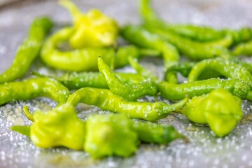 Mix of green peppers Shishito pepper Capsicum Annuum japonsea, or Japanese sweet pepper, not spicy and very tasty and Cambuci pepper Capsicum baccatum, green bell-shaped pepper