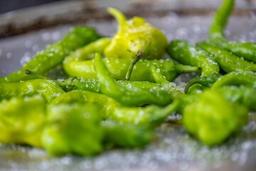 Mix of green peppers Shishito pepper Capsicum Annuum japonsea, or Japanese sweet pepper, not spicy and very tasty and Cambuci pepper Capsicum baccatum, green bell-shaped pepper