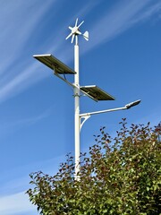 The Solar and Wind Energy Hybrid Street Light provides an ecofriendly solution. A modern street light designed to harness both solar and wind energy, providing sustainable, ecofriendly illumination.