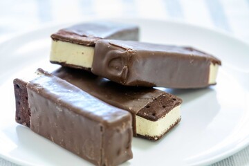 Delicious luxury gourmet ice creams in the shape of an Italian-style sandwich with chocolate topping