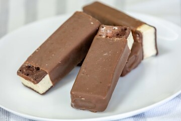 Delicious luxury gourmet ice creams in the shape of an Italian-style sandwich with chocolate topping
