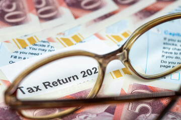 UK Tax Return. Financial Concept. Self-employment, Self-Assessment, dual resident, UK property.