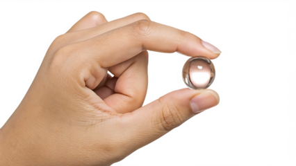 Hand holding clear glass sphere on white background isolated on a transparent background