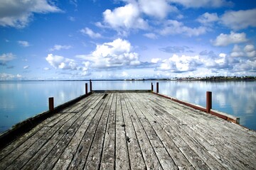 An old bridge near Borgarnes in Iceland. View of the horizion, blue sky and reflections on the ocean