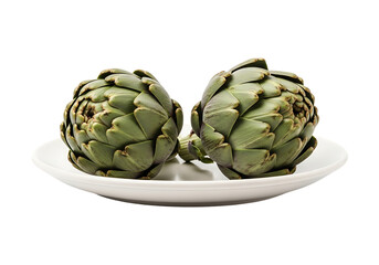 Obraz premium Two fresh artichokes on a white plate isolated on transparent background