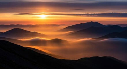 Misty Mountain Ridges at Sunset, Golden Light Filtering Through Clouds