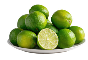Fresh limes piled high on a white plate.  Bright green, juicy limes, some halved, sit closely together on a simple white plate against a black background