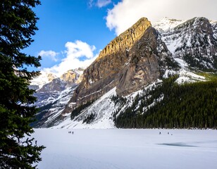 Snowy mountains over frozen lake