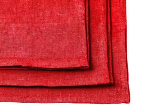 Close-up of three crimson linen napkins, stacked