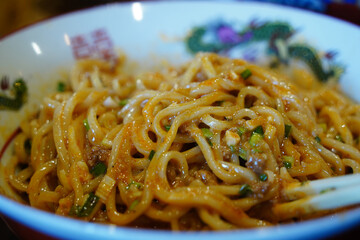 Close-up of Delicious Dan Dan Noodles in a Bowl
