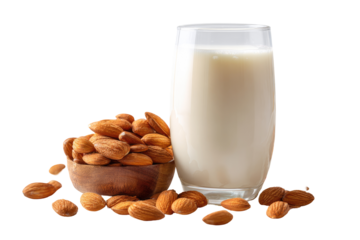Almond milk and almonds. A glass of creamy almond milk sits beside a wooden bowl filled with whole almonds